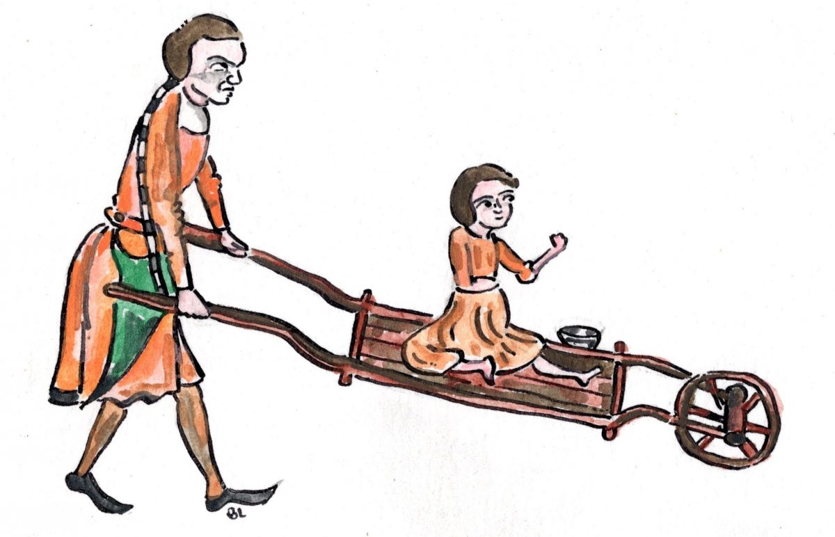 child on medieaval wheelbarrow